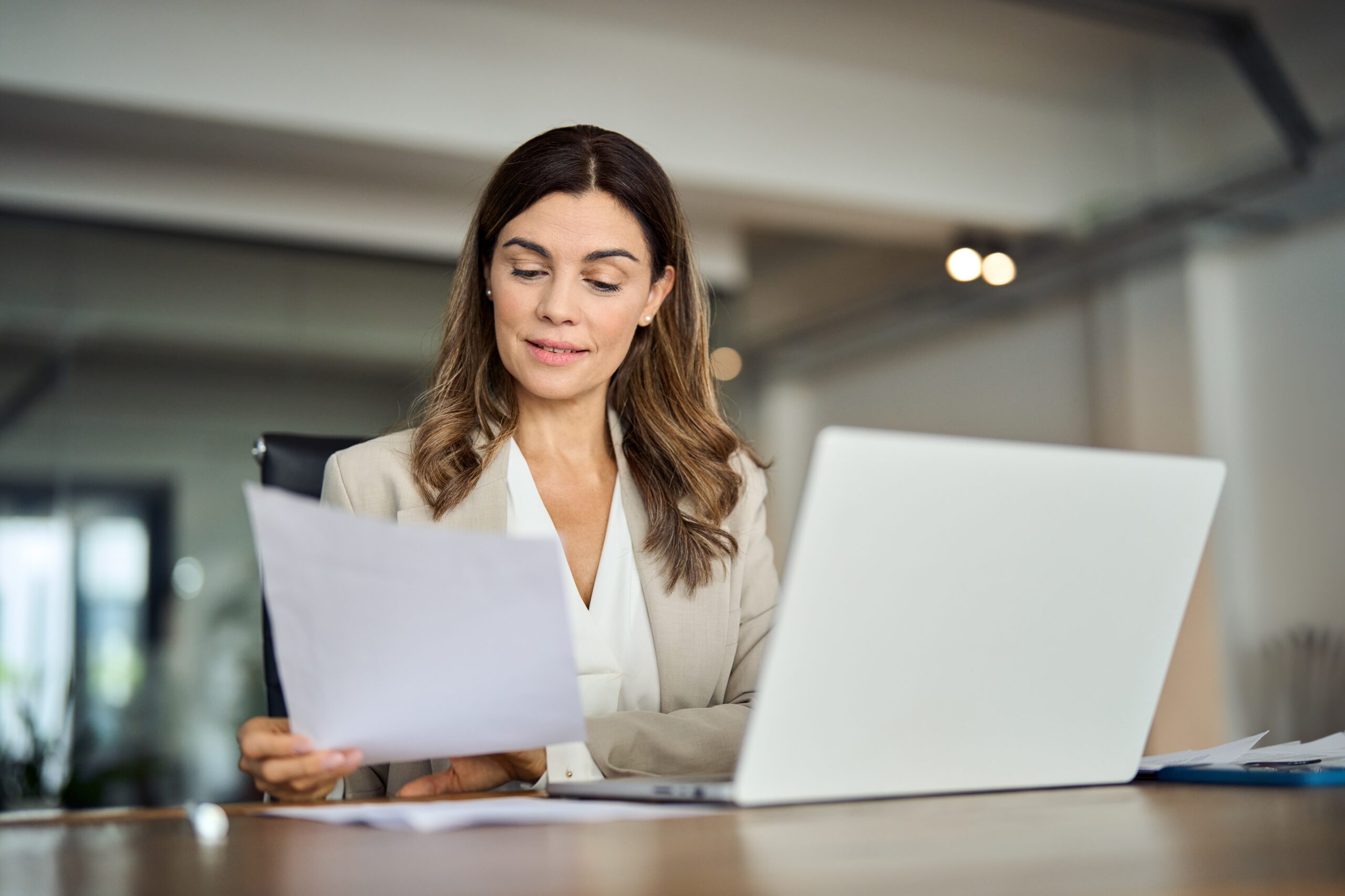 Busy,40,Years,Old,Business,Woman,Working,In,Office,Checking Professional reviewing a document